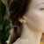 Gold Steel Stud Earrings with Cross Design - Monera-Design Co., Ltd